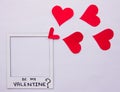 concept love picture frame with words be my valentine with red hearts coming out flat lay on white background