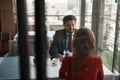 Young man and woman having meeting in restaurant Royalty Free Stock Photo