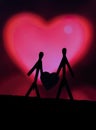 Concept of loving couples with matchsticks. Male and Female close together with beautiful heart shapes in the background. Royalty Free Stock Photo