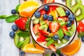 Concept of low calories delicious dessert. Summer fresh bowl with colorful fruit salad. Healthy natural organic food. Tasty snack Royalty Free Stock Photo