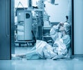 Concept of medecine surgery, Kovid 19. Tired, exhausted doctor after an exhausting shift in the intensive care unit Royalty Free Stock Photo