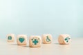 Concept of medical and healthcare. wooden cube blocks with medical   icons. treatment and medicine symbol signs Royalty Free Stock Photo