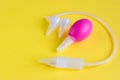 The concept of medicine and hygiene of the child. Children`s nasal aspirator on a yellow background. Copyspace Royalty Free Stock Photo