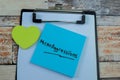 Concept of MicroAggressions write on sticky notes isolated on Wooden Table