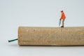 Concept miniature people destroying a Firecracker Royalty Free Stock Photo