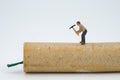 Concept miniature people destroying a Firecracker Royalty Free Stock Photo