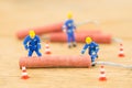 Concept miniature people working on Firecracker Royalty Free Stock Photo