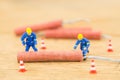 Concept miniature people working on Firecracker Royalty Free Stock Photo