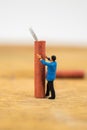 Concept miniature people working on Firecracker Royalty Free Stock Photo