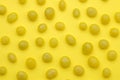The concept of minimalism. background of delicious bright yellow sweets on a bright yellow background. top view Royalty Free Stock Photo