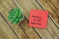 Concept of Minutes of The Meeting write on sticky notes isolated on Wooden Table