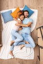 Young adult girlfriend and boyfriend sleeping together on bed Royalty Free Stock Photo