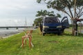 chair and table infront of campervan. Picnic concept. campervan parked under the tree and beside the river. concept of mobile
