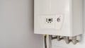 White modern gas water heater at the kitchen closet Royalty Free Stock Photo