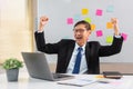 Concept of modern leadership, Senior in business raises his arms in happiness after successful work