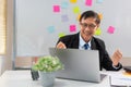 Concept of modern leadership, Senior in business raises his arms in happiness after successful work