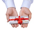 Concept, money as a gift, win or bonus. Man`s with both hands in shirt takes or gives pile of 100 dollar and red ribbon with bow Royalty Free Stock Photo