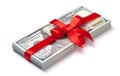 Concept, money as gift, win or bonus. Pile of 100 dollar bills is tied with red ribbon with bow. Isolated on white Royalty Free Stock Photo