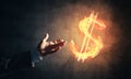 Concept of money making with dollar currency fire symbol on dark