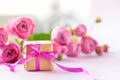 Concept Mother`s Day, Valentine`s Day. Gift present box with beautiful pink flowers roses bouquet Royalty Free Stock Photo