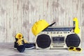 The concept of the music Hip hop style.Vintage audio player with headphones,fashionable cap, sneakers and sunglasses. Royalty Free Stock Photo