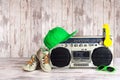 The concept of the music Hip hop style.Vintage audio player with headphones,fashionable cap, sneakers and sunglasses. Royalty Free Stock Photo