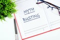 Concept MYTH BUSTING word, text in a business notebook, a note on a white background