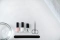 Concept of nail care, set of accessories for manicure on white background, flat lay, top view, copy space Royalty Free Stock Photo