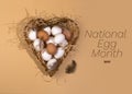 Concept for National Egg Month. The name of the holiday is written over the image. White and brown eggs lie on shavings in a heart Royalty Free Stock Photo