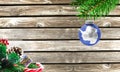 Concept of New Year and Christmas, on a wooden background, Christmas tree branches and a Christmas toy with the flag of Antarctic