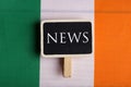 concept news feeds - Breaking news, irish country& x27;s flag, blackboard and the text News Royalty Free Stock Photo