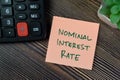 Concept of Nominal Interest Rate write on sticky notes isolated on Wooden Table