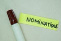 Concept of Nominations write on sticky notes isolated on Wooden Table