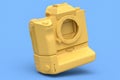 Concept of nonexistent gold DSLR camera isolated on blue monochrome background. Royalty Free Stock Photo