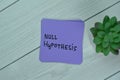 Concept of Null Hypothesis write on sticky notes isolated on Wooden Table