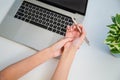 Concept office syndrome hand pain from occupational disease, woman having wrist pain from using computer, wrist pain Royalty Free Stock Photo