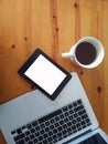 Concept for an office table mock up. Cup of coffee, tablet, and laptop Royalty Free Stock Photo