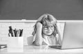 concept of online education. nerd kid in glasses with laptop. september 1. e-learning Royalty Free Stock Photo