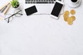 Concept of online payment with credit card with smart phone, laptop computer on office desk on clean bright marble table