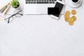 Concept of online payment with credit card with smart phone, laptop computer on office desk on clean bright marble table