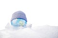 The concept of the onset of cold weather. A planet in a hat and in the snow. 3D render