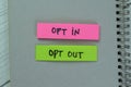 Concept of Opt in or Opt Out write on sticky notes isolated on Wooden Table