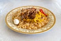 The concept of oriental cuisine. Homemade Uzbek pilaf or plov from lamb in plate. C
