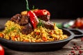 The concept of oriental cuisine. National Uzbek pilaf with meat in a cast-iron skillet, on a wooden table. background image