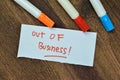 Concept of Out Of Business write on sticky notes isolated on Wooden Table