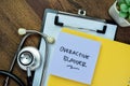 Concept of Overactive Bladder write on sticky notes with stethoscope isolated on Wooden Table