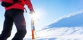 Concept: overcome challenges. Mountaineer faces a climb at the t Royalty Free Stock Photo