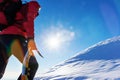 Concept: overcome challenges. Mountaineer faces a climb at the t Royalty Free Stock Photo