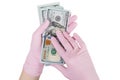 Concept of paid medicine. gloved hands holding a dollars