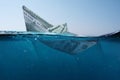 Concept paper dollar boat sinking in the sea with a view underwater. Finance and crisis, a creative idea. Falling exchange rates. Royalty Free Stock Photo